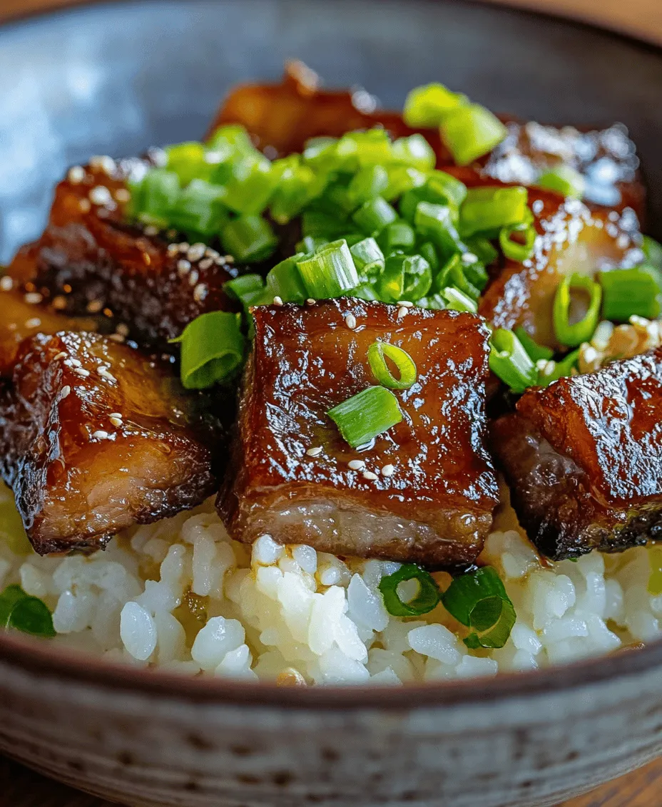 Sake-and-Soy-Braised Pork Belly is a dish that embodies the essence of Japanese home cooking. Known as 